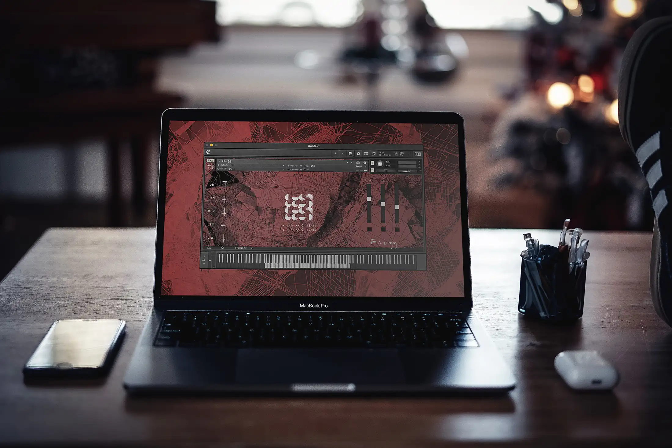 laptop with FNUGG user interface. Kontakt user interface showing custom channel strips for sample library.